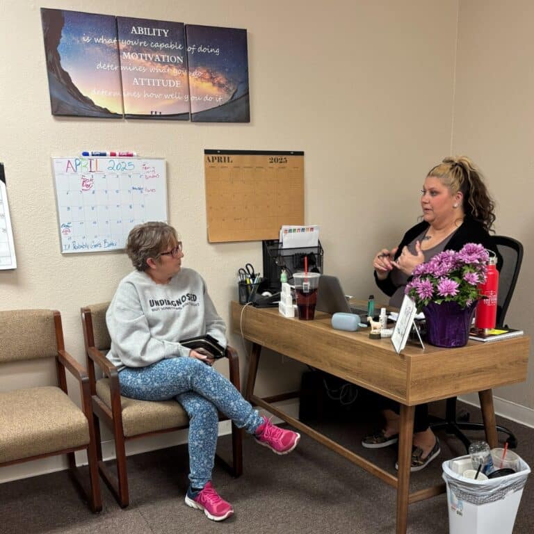 Sara, our North Platte Care Coordinator, reviewing client care plans with one of our caregivers.